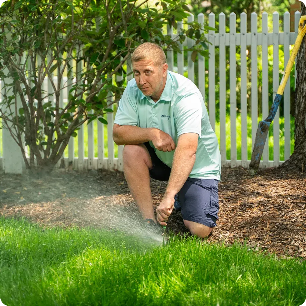 Dreamlawn technician working on irrigation system