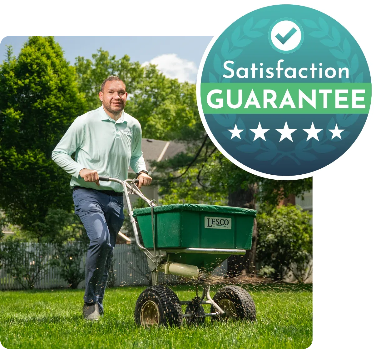 DreamLawn technician fertilizing lawn