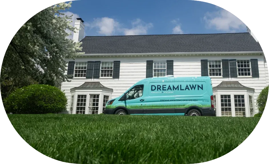 DreamLawn branded service van parked in front of a residential home in Kansas City