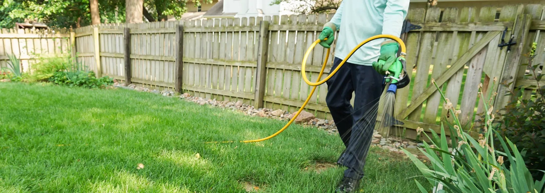 technician spraying lawn