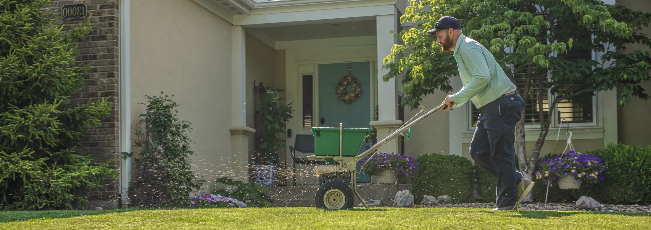 technician seeding lawn