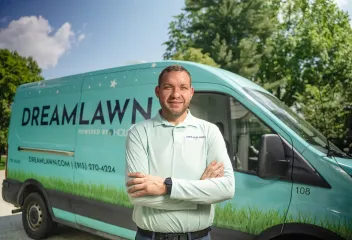 team-member-in-front-of-truck